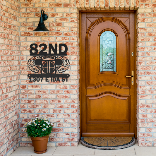 Airborne_-_Metal_Sign_Black_Brick_Entrance_Mockup.png